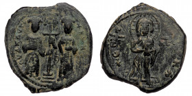 Constantine X Ducas and Eudocia AD 1059-1067. Constantinople Follis AE ( Bronze. 11.31 g. 29 mm)
Christ standing facing on footstool, wearing nimbus a...