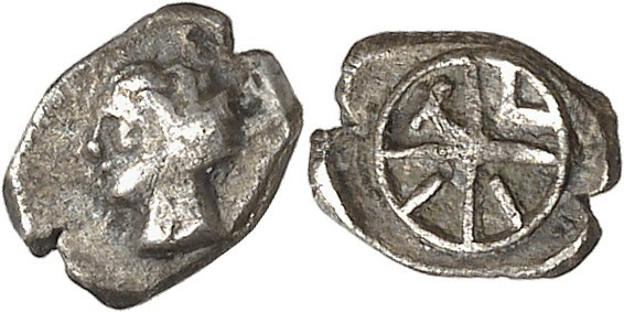 Nedènes (oppidum de Montlaurès). Hémiobole TVII à la roue c.90-40 av. J.-C.

A...