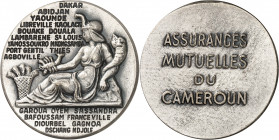 Ahmadou Ahidjo (1960-1982). Jeton des Assurances mutuelles du Cameroun ND (1964-1996), Paris.

Av. Allégorie de l’Afrique assise à gauche, coiffée d...