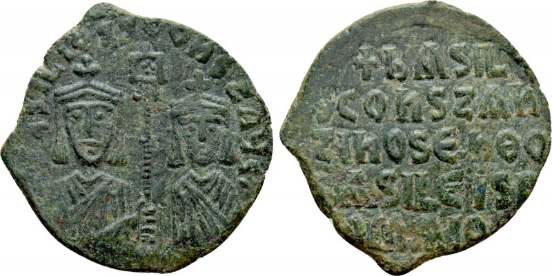 BASIL I THE MACEDONIAN with CONSTANTINE (867-886). Follis. Constantinople (or un...