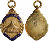 BURMA. Gold Athletic Association Medal, 1932. Grade: ABOUT UNCIRCULATED.

Weight: 5.88 gms. A blue enameled 9 carat (0.375 fine) gold Medal with att...