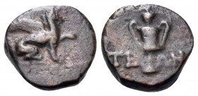 IONIA. Teos. Circa 370-300 BC. (Bronze, 15 mm, 2.05 g, 12 h). Griffin seated right, left forepaw raised. Rev. THI-ΩΝ Kantharos; grape bunch above. Kin...
