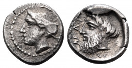 CILICIA. Nagidos. Circa 400-380 BC. Obol (Silver, 9 mm, 0.80 g, 11 h). Head of Aphrodite to left, hair bound in sphendone. Rev. ΝΑΓΙ Bearded head of D...