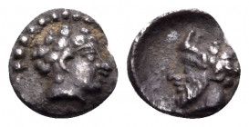 CILICIA. Uncertain. 4th century BC. Tetartemorion (Silver, 5 mm, 0.15 g, 9 h). Male head with tight curls to right. Rev. Horned head of bearded Pan to...
