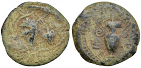 JUDAEA, Procurators. Valerius Gratus, 15-26 CE. Prutah (Bronze, 16 mm, 1.79 g, 5 h), Jerusalem, year 4 of Tiberius = 17-18 CE. IOYΛIA Vine leaf with s...