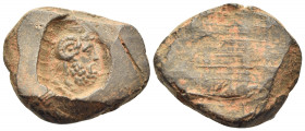 UNCERTAIN EAST. 1st-2nd centuries. Seal or Bulla (Clay, 20 mm, 1.53 g, 12 h). Bearded head of Zeus-Ammon to right, with ram's horn curled above ear. R...