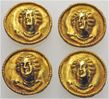 HELLENISTIC GREEK. A collection of four circular attachments with the head of Dionysos, 2nd-1st century BC. (Gold, 20 mm). Brief report of Dr. Jack Og...