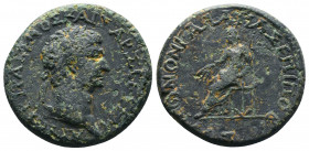 GALATIA, Koinon of Galatia. Trajan. AD 98-117. Æ. Pomponius Bassus, magistrate. Laureate head right / Zeus seated left, holding thunderbolt and scepte...