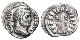 Maximianus AR Argenteus. Carthage, AD 300. MAXIMIANVS AVG, laureate head right / .C VI in two lines within laurel wreath. RIC 15b; Jeločnik -; RSC 698...
