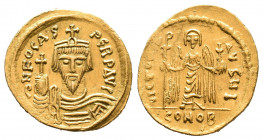 Phocas. (602-610 AD). Gold solidus. Constantinople, c. 607-609 AD. Officina I. D N FOCAS PERP AV, draped, cuirassed bust facing, wearing crown with pe...