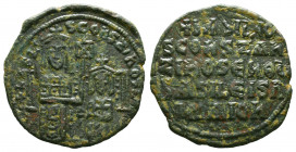 Basil I and Constantine VII, AE Follis. Constantinople. 867-876 AD. bASILIO S CONST BASILIS (or ..CONSTAN..), Basil, crowned, bearded and wearing loro...