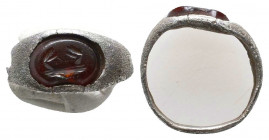 Roman Silver Ring With Intaglio, Circa 1st - 2nd Century AD.
The bezel contains a beautifully coloured, banded agate gem, which is finely carved to d...