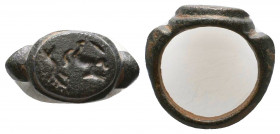 Roman Bronze Seal Ring with a Scene on bezel , Circa 1st - 2nd Century AD.

Weight: 8.5 gr
Diameter: 23 mm