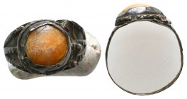 Roman Silver Ring with an inlaid red stone on bezel , Circa 1st - 2nd Century AD.

Weight: 1.8 gr
Diameter: 22 mm
