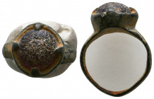 Roman Bronze Ring with an inlaid stones on bezel , Circa 1st - 2nd Century AD.

Weight: 3.9 gr
Diameter: 24 mm