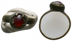 Roman Bronze Ring with an inlaid stones on bezel , Circa 1st - 2nd Century AD.

Weight: 2.4 gr
Diameter: 21 mm