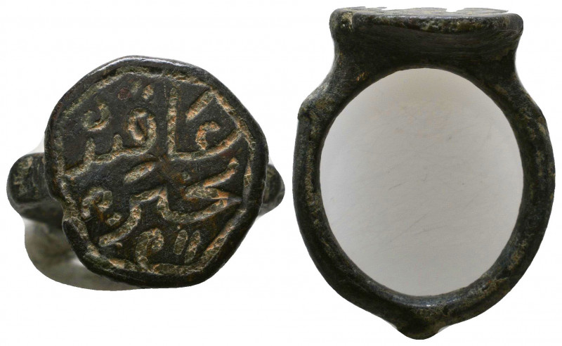 Ancient Bronze Ring with arabic inscription on bezel, 

Weight: 8.9 gr
Diamet...