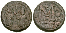 Arab-Byzantine, Umayyad Caliphate. AE follis (18.5 mm, 5.27 g, 6 h). Baalbek (Heliopolis) mint, struck ca. A.D. 685-690. Two imperial standing figures...