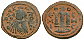 Arab-Byzantine, Umayyad Caliphate. AE follis (21 mm, 4.16 g, 7 h). Hims (Emesa) mint. Facing Umayyad Imperial bust / EMI to left of M,birds eye on eit...