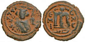 Arab-Byzantine, Umayyad Caliphate. AE follis (20.9 mm, 3.51 g, 7 h). Hims (Emesa) mint. Facing Umayyad Imperial bust / EMI to left of M,birds eye on e...