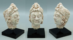 A marvelous Gandharan stucco head from the Indus Valley, ca. 4th - 5th Century A.D. This elaborately detailed example is 3-7/8? high and portrays a Bo...