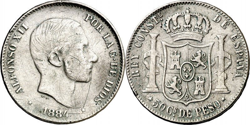 1884. Alfonso XII. Manila. 50 centavos. (AC. 121). Rayitas. Rara. 12,64 g. BC+.