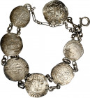 Pulsera formada por 7 monedas en plata (una hispanoárabe, el resto de los Reyes Católicos y los Austrias). A examinar. MC/BC.