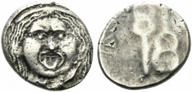 Etruria, Populonia, c. 3rd century BC. AR 20 Asses (22mm, 8.22g). Diademed facing head of Metus; X:X (mark of value) below. R/ Two kerykeia, the r. in...
