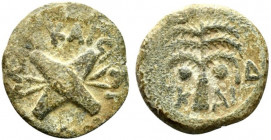 Judaea, Procurators. Antonius Felix (52-59 CE). Æ Prutah (16mm, 2.41g). Jerusalem, year 14 of Claudius (54/5). Two crossed shield and two spears. R/ P...