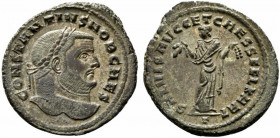 Constantius I (Caesar, 293-305). Æ Follis (28mm, 10.50g, 12h). Carthage, c. 298-9. Laureate head r. R/ Carthago standing facing, head l., holding frui...