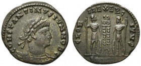 Constantine II (Caesar, 316-337). Æ Follis (16.5mm, 2.58g, 12h). Cyzicus(?). Laureate, draped and cuirassed bust r. R/ T Two soldiers standing holding...