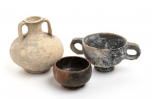 Lot of 3 (three) Greek - Roman potteries, including two black-glazed; two intact, the miniaturistic bowl restored; ca. 3rd - 2nd centuries BC; the hig...