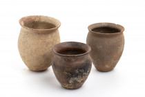 Lot of 3 (three) Roman pots, two intact one restored; ca. 2nd century BC - 3rd century AD; the highest cm 11