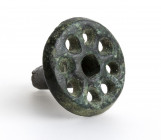 European Iron Age bronze pin-head in the form of a spoked wheel; untouched glossy green patina; ca. 8th century BC; height cm 2,4, diameter cm 2,4