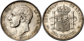 1883*1883. Alfonso XII. MSM. 1 peseta. (AC. 21). Leves rayitas. Bella. Brillo original. Rara así. 4,96 g. EBC.