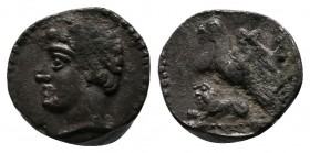 Cilicia, Uncertain. 400 BC. AR Obol (10mm-0.60g). Head left, wearing wreath of grain ears / Eagle, with spread wings, standing left on the back of lio...