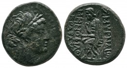 Ionia, Smyrna, (c.105-95 BC.) Æ Homerion (21mm-8,90g). Menophilos Krabaus, magistrate. Laureate head of Apollo right / ΣMYΡNAIΩ[N] The poet Homer seat...