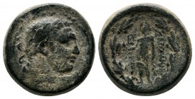 Lydia, Sardeis. Autonomous, c.2nd BC. (17mm-7,14g) Bearded head of Herakles right / ΣAΡΔIANΩN [HΡAIOΣ], Apollo, naked, standing left, holding raven an...