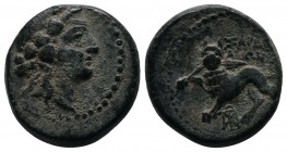 Lydia, Sardes. c.2nd-1st centuries BC. AE ( 16mm-5.67g). Head of Dionysos right, wearing ivy wreath. / ΣΑΡΔΙΑΝΩΝ. Horned lion standing left, head faci...
