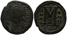 Justinian I. AD 527-565. AD 543/4. Constantinople. 4th officina. AE Follis (37mm-19.52g). D N IVSTINI-ANVS P P AVG; helmeted, draped, and cuirassed bu...
