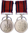 Nepal Royal Guards Service Medal 1977
Circular silvered metal medal on double kukri and ribbon bar suspension; the face with a double-triangle six-po...