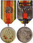 Romania Military Merit Medal, I Class, "RPR" version 1980
in bronze gilt with red enamels, measuring 31.3 mm in diameter, original ribbon, mounted to...