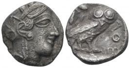 Attica, Tetradrachm Tetradrachm circa 405, AR 23.00 mm., 15.26 g.
Head of Athena r., wearing Attic helmet decorated with olive leaves and palmette. R...