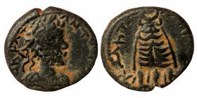 MESOPOTAMIA, Carrhae. Septimius Severus, 193-211. AE (bronze, 2.34 g, 14.50 mm). Illegible inscription, laureate head right Rev. KAPHN-? Simulacrum of...
