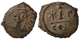 Maurice Tiberius. 582-602. Decanummium (bronze, 2.62 g, 18 mm). Constantinople mint, struck 582/3. Helmeted, draped, and cuirassed bust facing. Rev La...