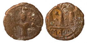 Umayyad Caliphate, circa 680s-700/10. Æ Fals (bronze, 3.31 g, 18 mm). Emperor standing facing, holding long cross and globus cruciger. Rev. Large m, l...