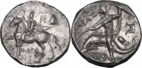 Greek Italy. Southern Apulia, Tarentum. AR Nomos, c. 215-212 BC. Xenokrates magistrate. Obv. Bearded strategos on horse walking left, wearing short tu...