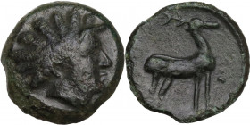 Greek Italy. Bruttium, Kaulonia. AE 14.5 mm. c. 425-420 BC. Obv. Horned head of river-god right; [before, ΘΕ]. Rev. Stag standing right; pellet or tra...