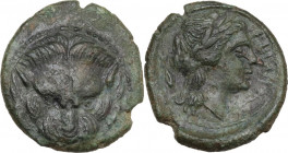 Greek Italy. Bruttium, Rhegion. AE 15 mm. circa 351-280 BC. Obv. Facing lion-mask with pointed ears. Rev. PHΓINON. Head of Apollo right; behind, dolph...
