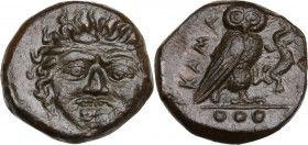 Sicily. Kamarina. AE Tetras or Trionkion, c. 420-410 BC. Obv. Gorgoneion facing, tongue slightly protruding. Rev. KAMA. Owl standing right, head facin...